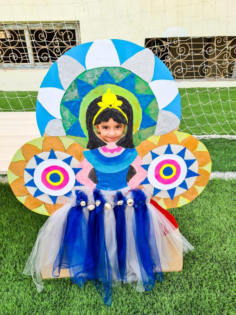 A child in a colorful and imaginative costume at IVY STEM International School, showcasing creativity and outdoor activities.